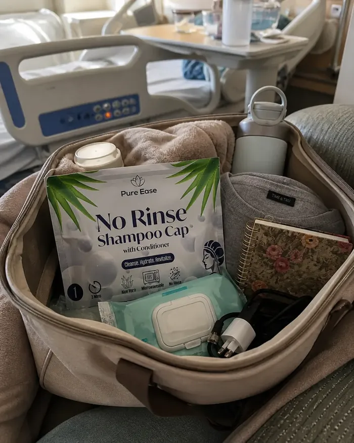 Hospital overnight bag flatlay with PureEase shampoo cap and body wipes